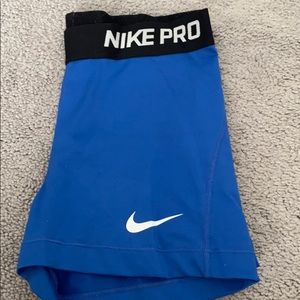 blue nike pros with ECE logo